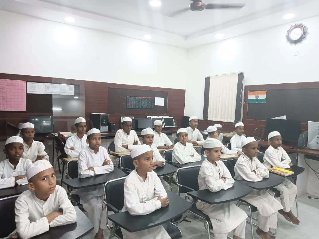 Students hold fresh notebooks and readers outside their school after a supply handoff. The gift is small, but it says: you belong here, keep coming back.