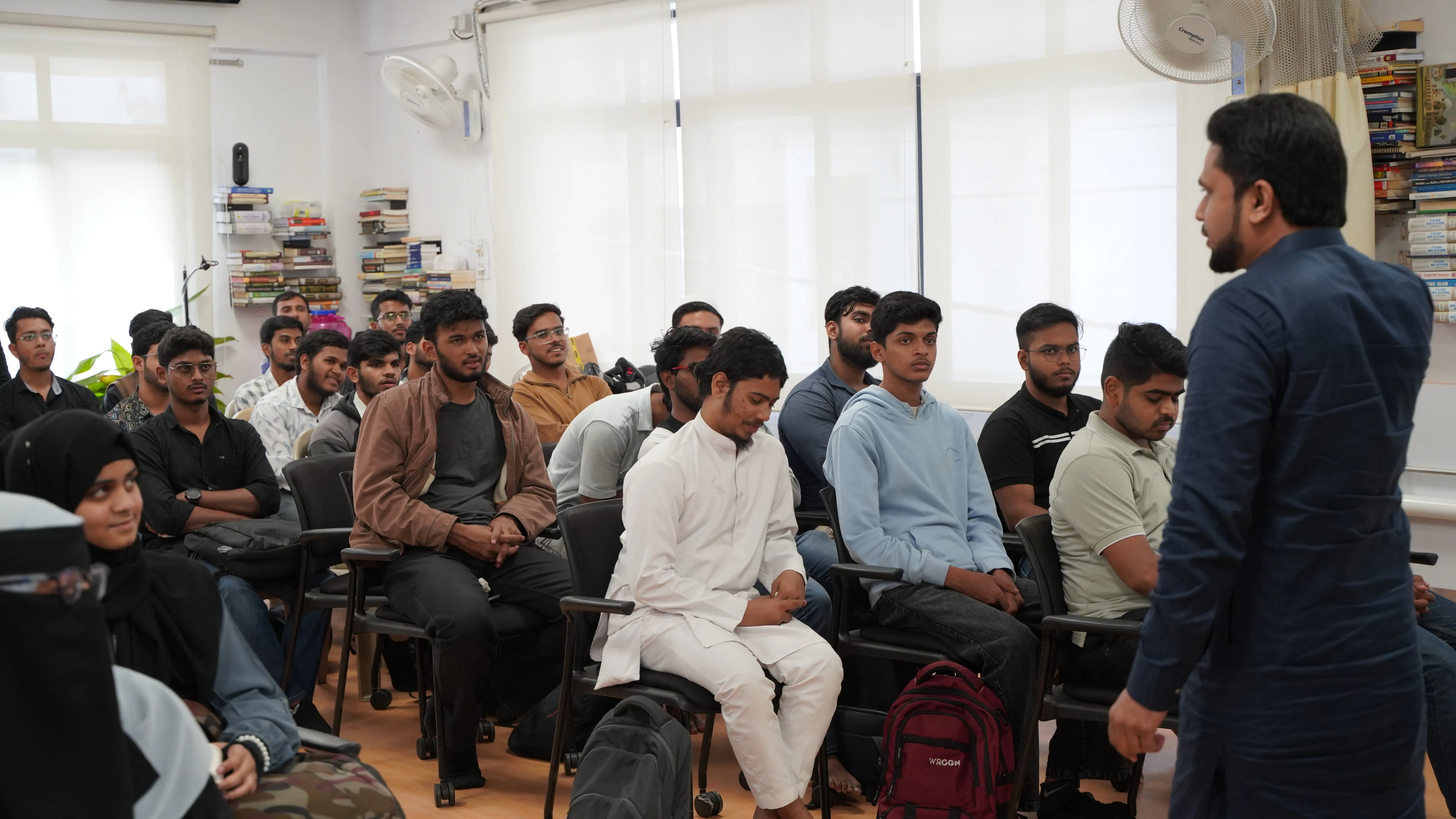 Community members gathered in a warm event space.